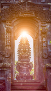 Gate in Pura Besakih Temple temple with Hindu Altar in sun light flares. Gate in Pura Besakih Temple temple with Hindu Altar in sun light flares.